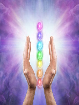 Male parallel hands facing upwards against a purple magenta background of radiating energy and the Seven Chakras floating between his hands